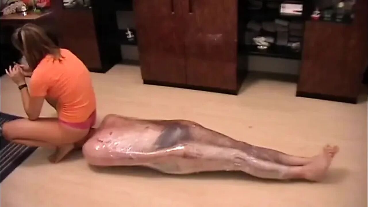 Nasty mistress tied up her slave with a plastic foil