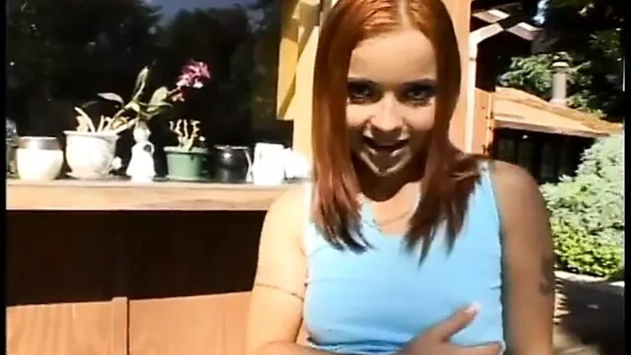 Slim young redheaded slut kneels and sucks five jizz-dripping cocks