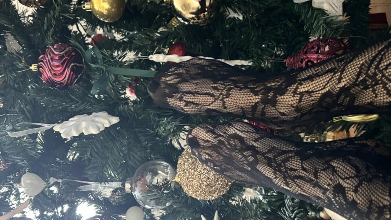 Playing with a christmas three with my legs in stockings