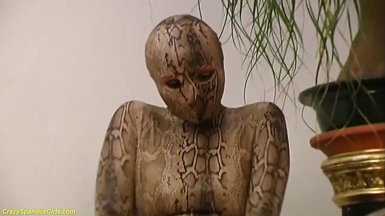 Big boob blonde girl in skintight spandex snake catsuit stripping for you