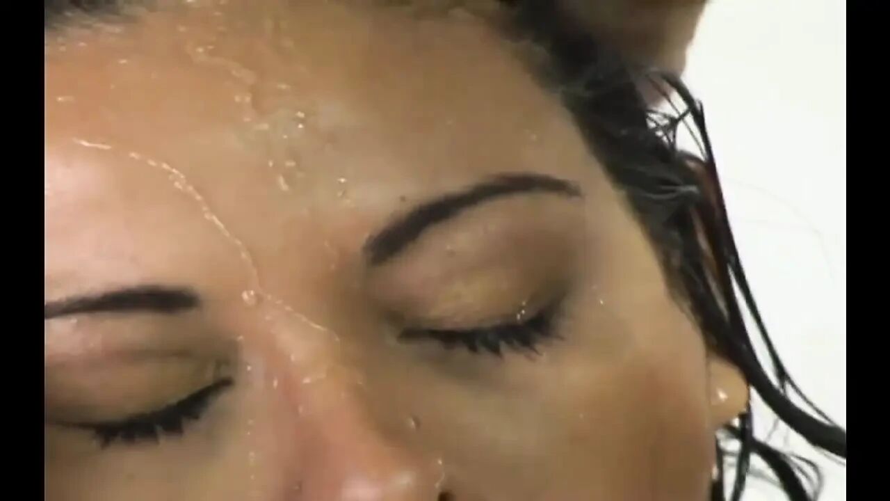 Intimate Shower Moments: Two Dark-skinned Partners Engaging in Sexual Intercourse