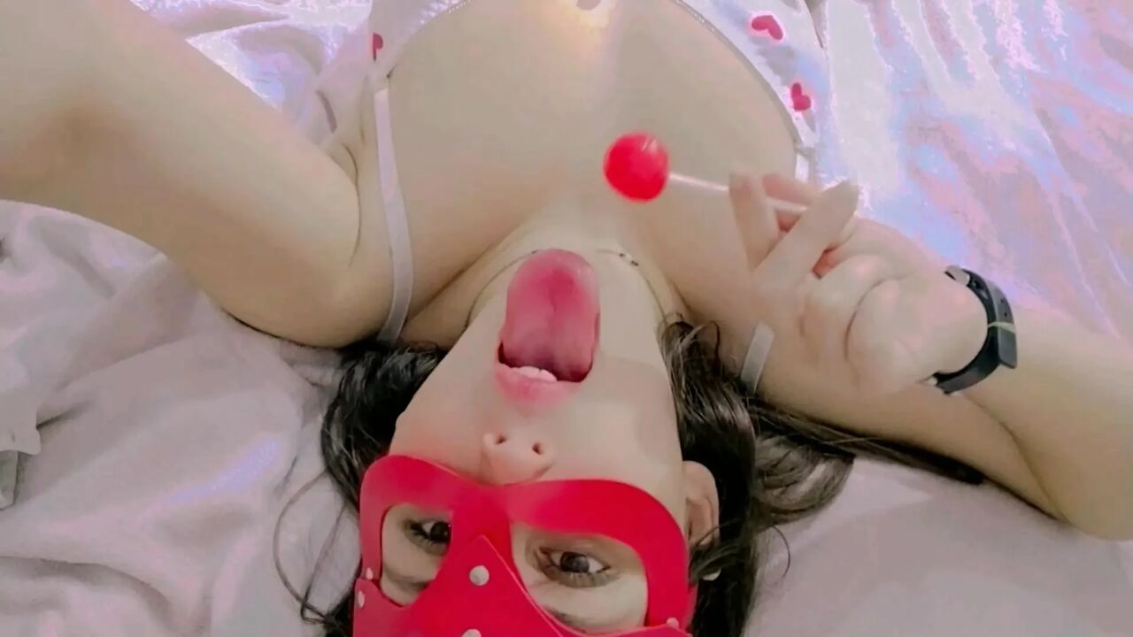 Hot and naughty student sucking lollipops at the bed wearing her new white lingerie and touching herself
