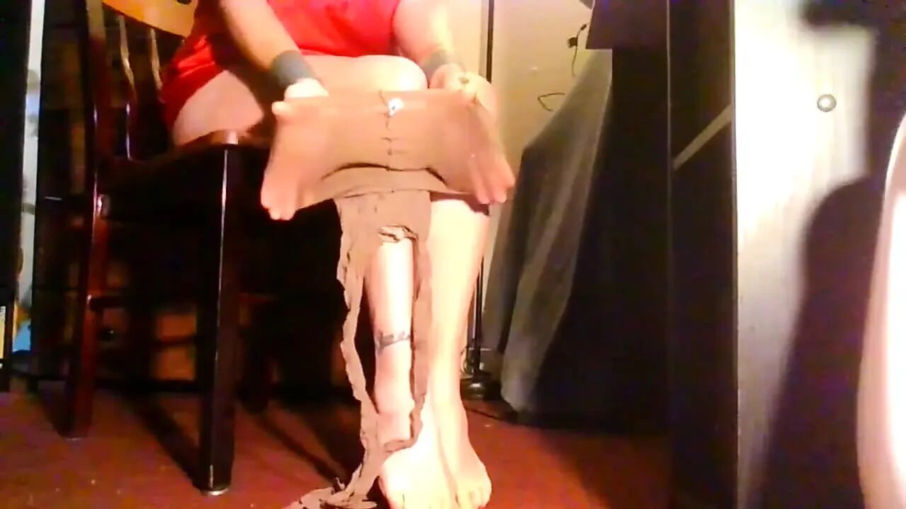 Putting on New Nylon Pantyhose Reinforced Suntan