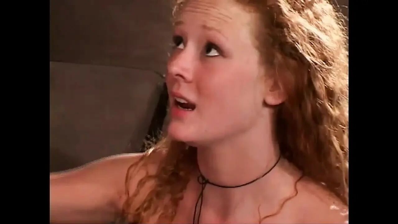 Young redhead takes two big cocks