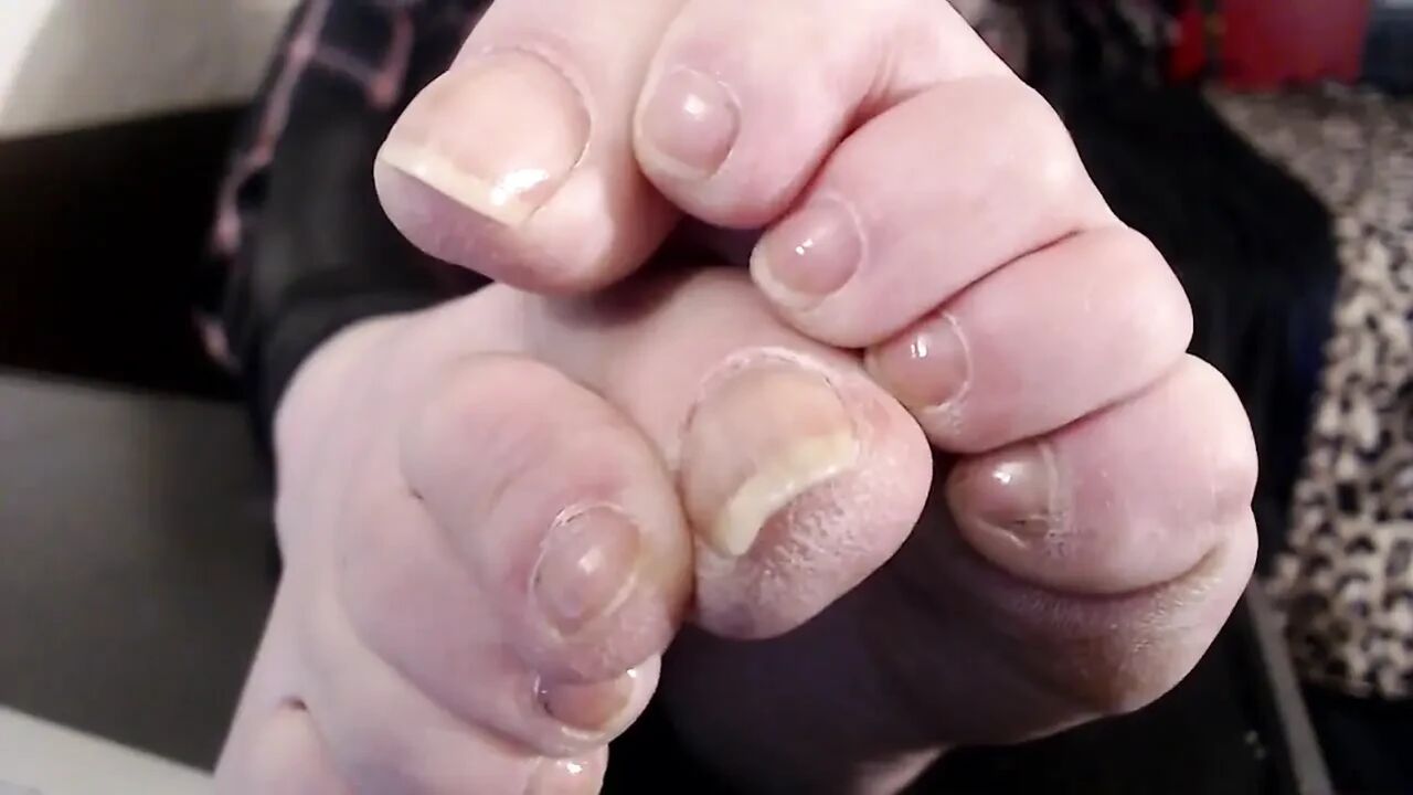 Closeup long real toenails