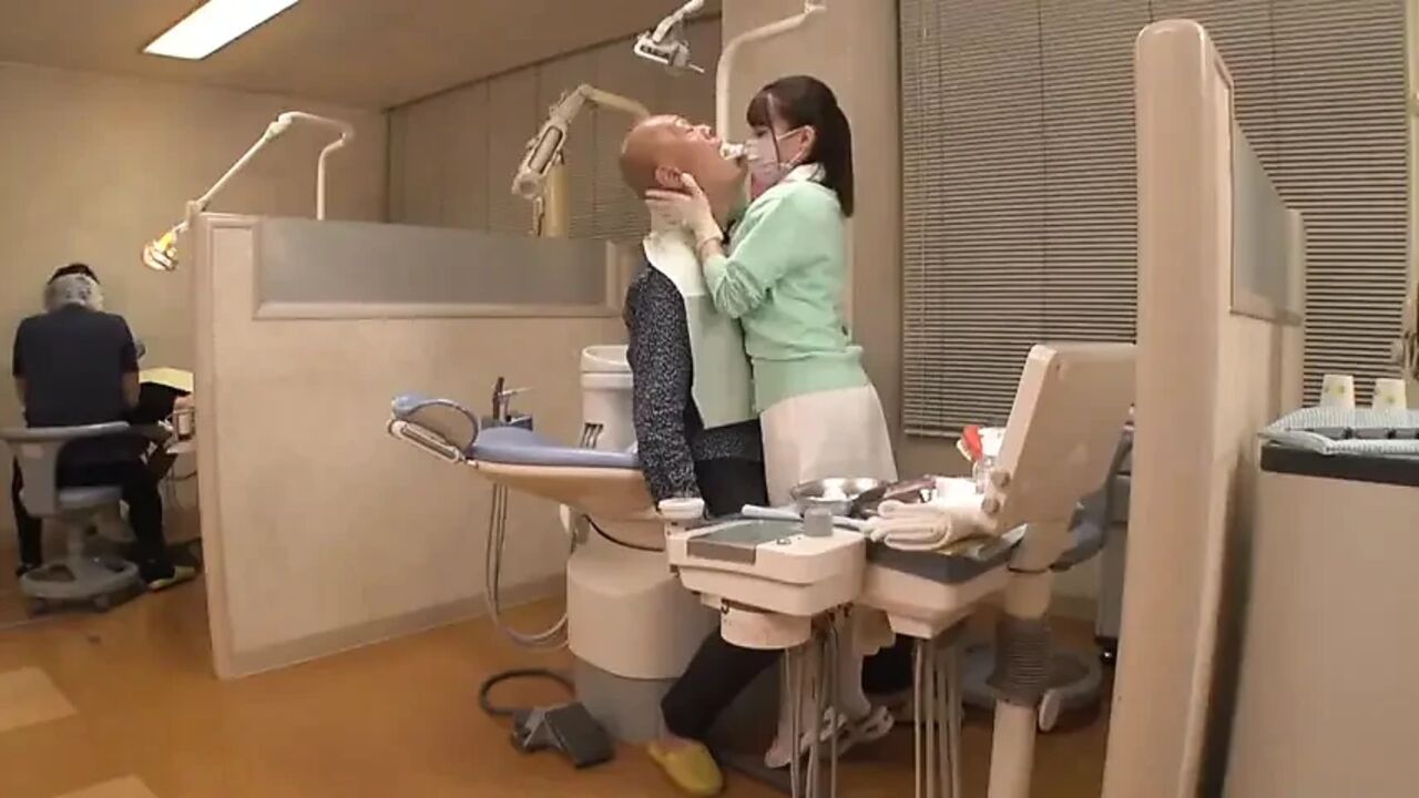 Elegant Dental Hygienist Leaning Close