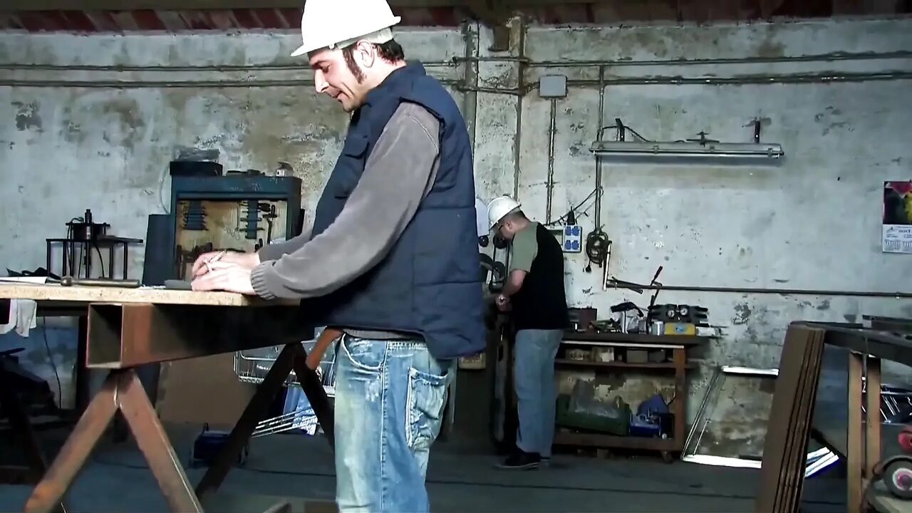 Two young sluts get fucked by workers in a garage