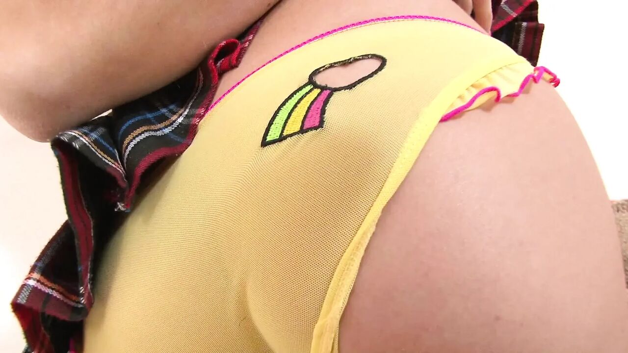 Sexy small tits uniformed brunette plays with her candy on the bed