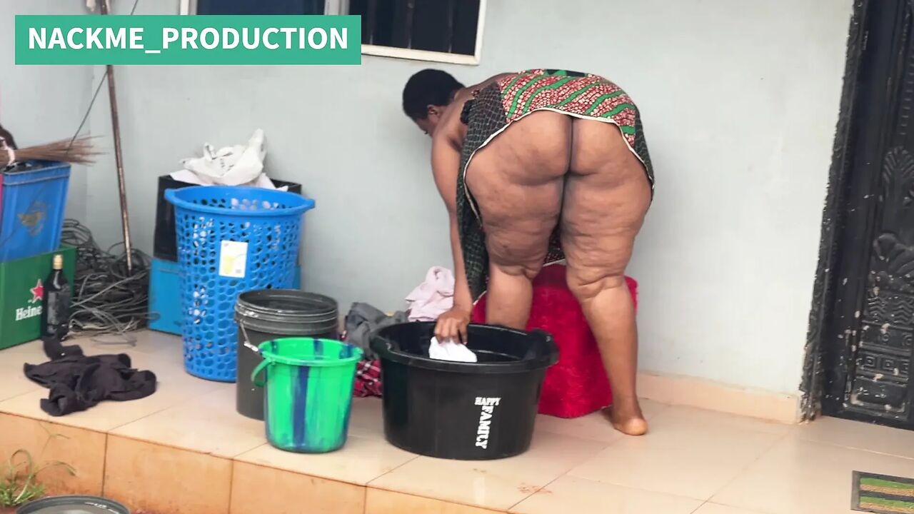 African Mama Multitasks on a Sunday Morning