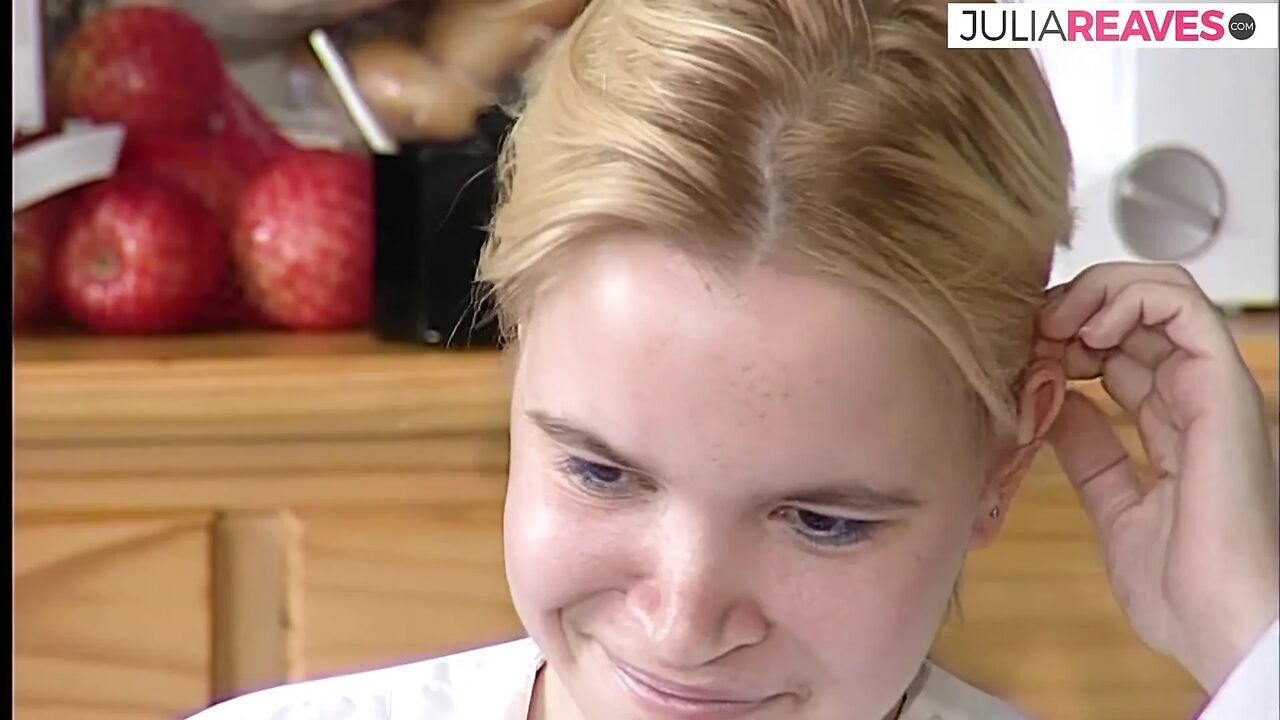 Shy blonde looks down while chatting with lover