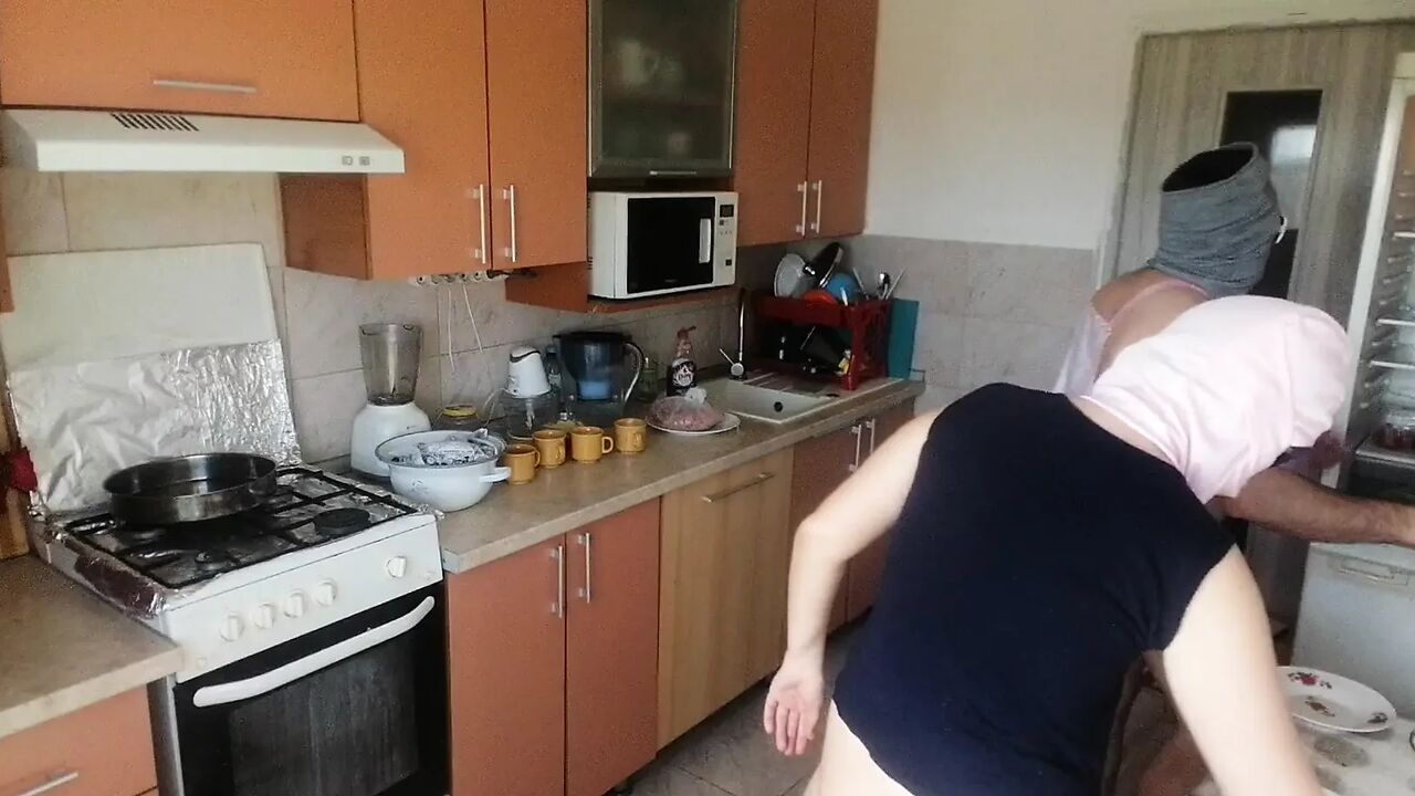 Amateur couple cooks naked in the kitchen