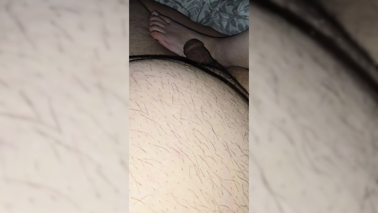 Step mom lets step son fuck her feet while sitting in bed