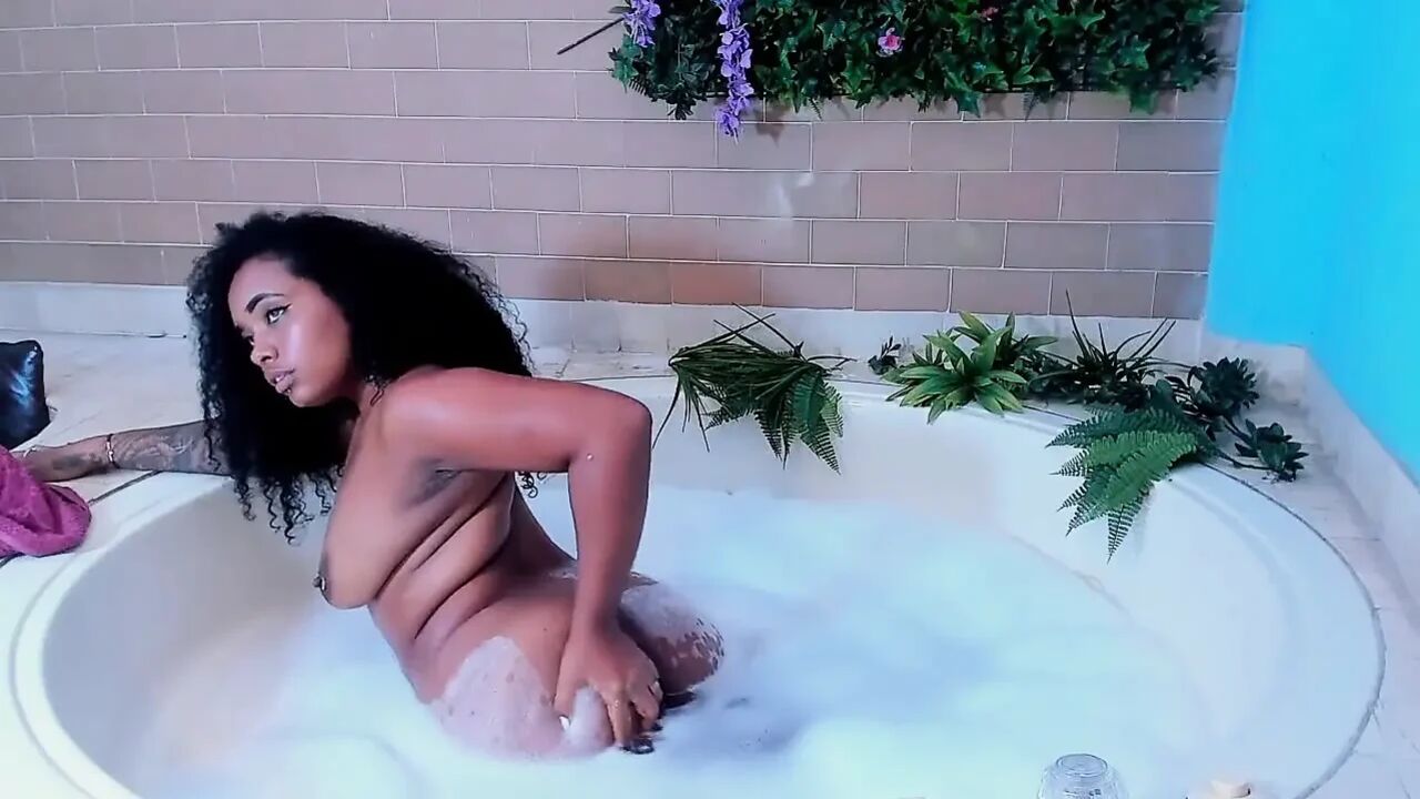 Big Black Woman Masturbates in the Jacuzzi
