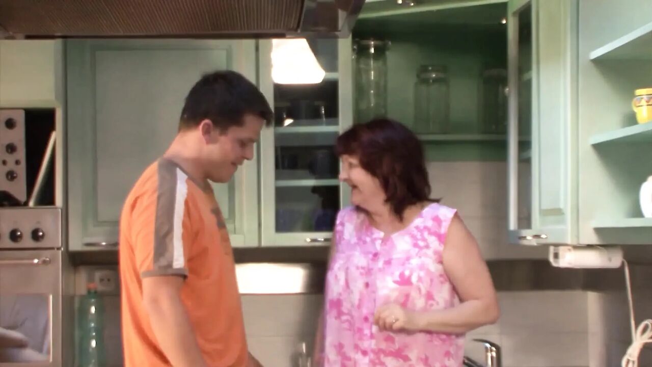 Grandma fucked by the horny neighbor boy in the kitchen