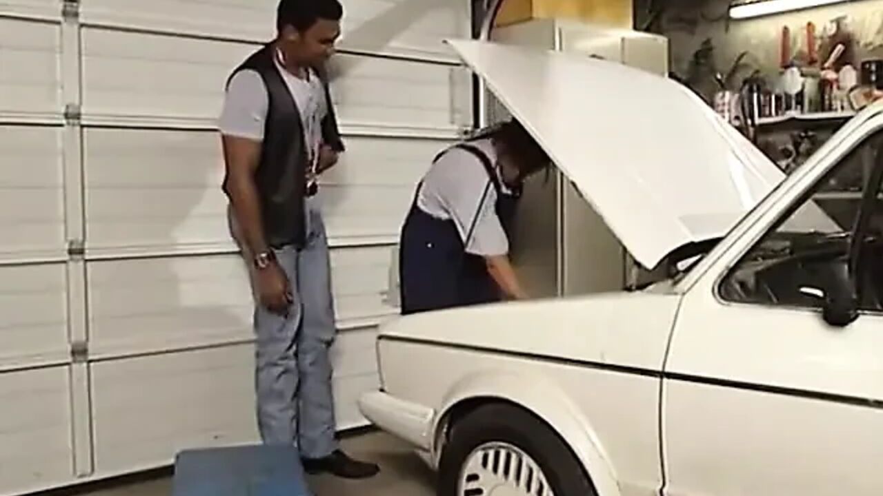 Threesome in the Car Garage with a Black Stud and Double Penetration