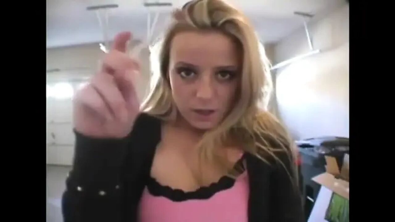 Blonde bitch smoking a cigarette in a close up video