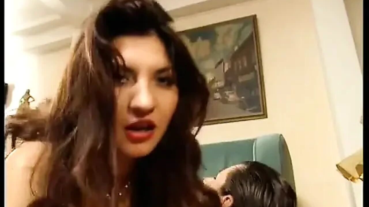 Omg! Busty Brunette in Latex Gets Fucked by Two Guys on Couch