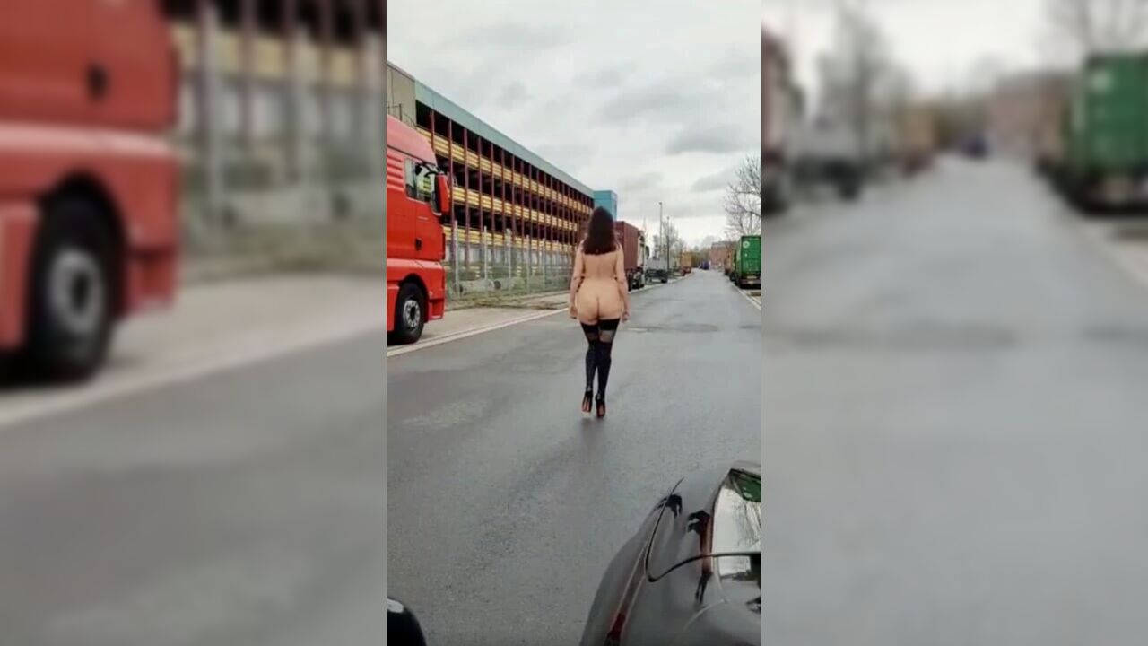 Naked Walk Between Trucks