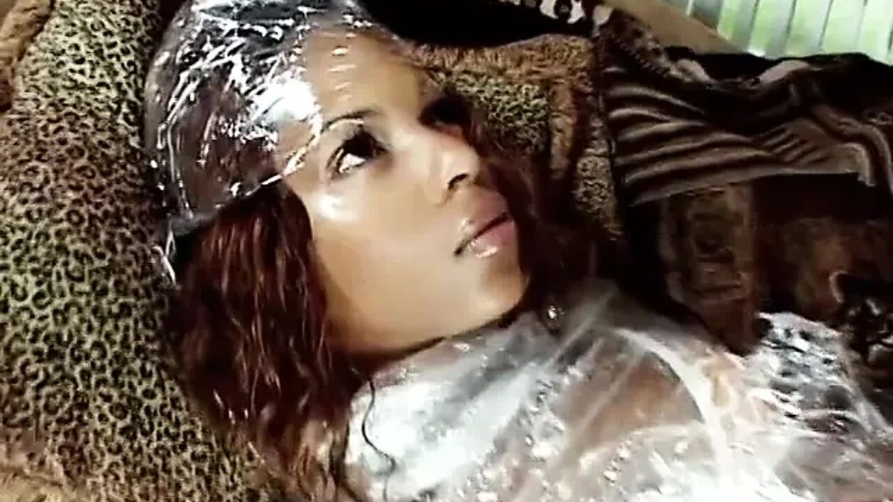 Dude has his own ebony doll wrapped in cellophane ready to use for a fuck session