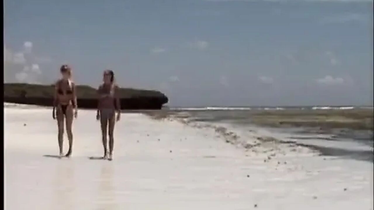 Lesbians From Germany Licking Each Other on the Beach