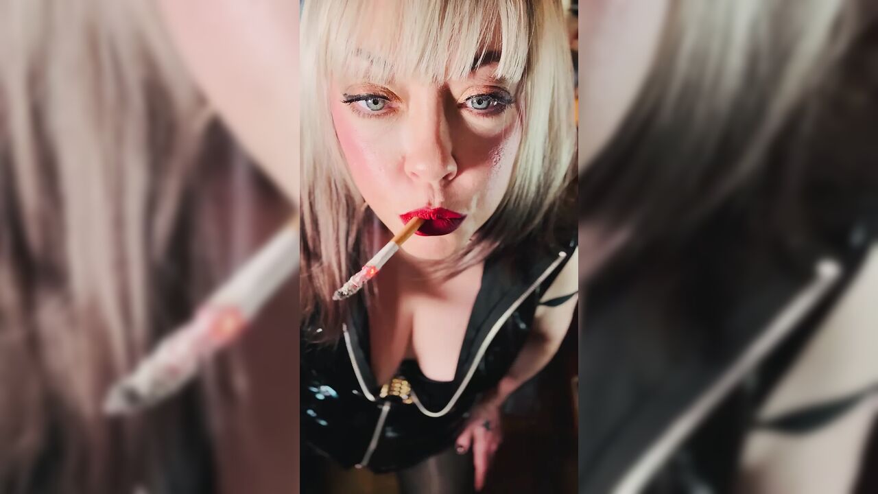 Miss Tina Snua Dressed In PVC & Smoking A Cork Cigarette With Lots Of Dangling, Snap Inhales, OMI & OME