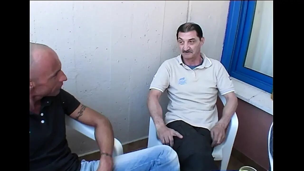 Two Young Sluts Surrounded by a Group of Mature Men