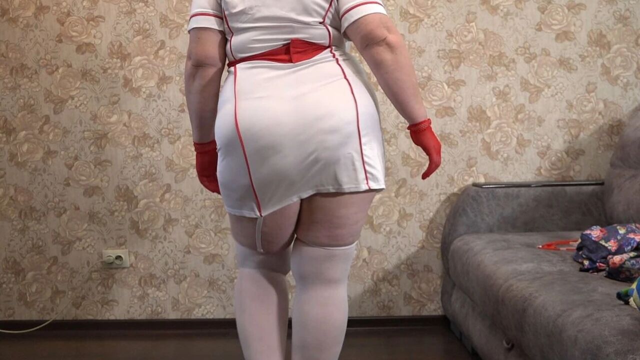 A Mature Wife Is Getting Ready for a Christmas Party and Trying on a Nurse's Uniform. Does She Want to Get Fucked There? PAWG.
