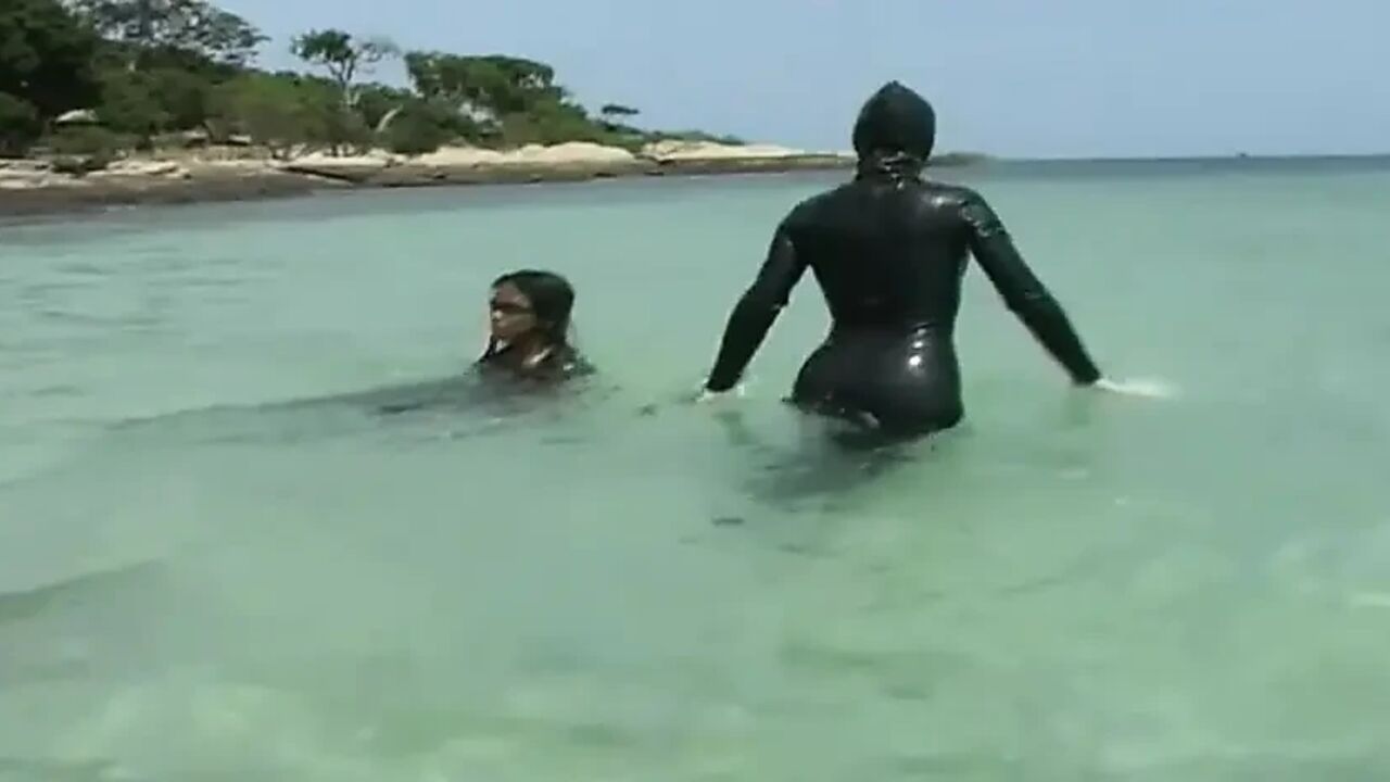Girls in latex on the beach