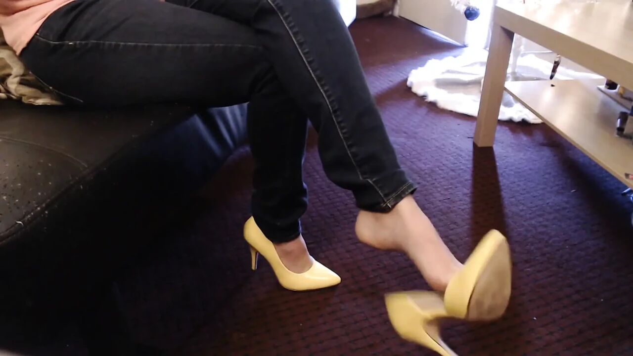 Double crossed yellow pumps dangling