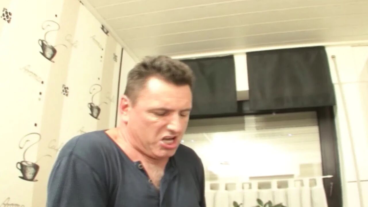 Attractive German maid in stockings rides dick in the kitchen