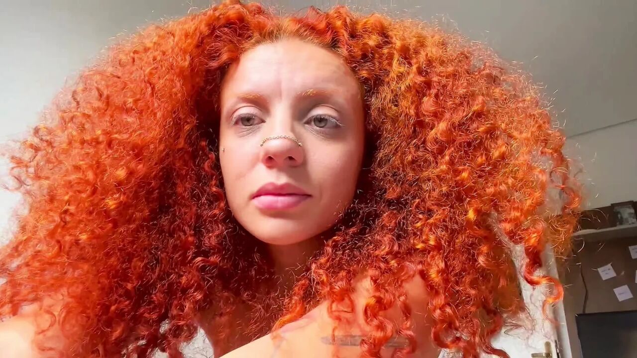 Naughty redhead squirts all over the bed