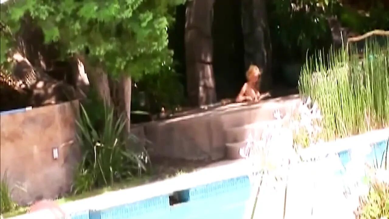 He Is Lying by the Pool When She Sits on His Cock