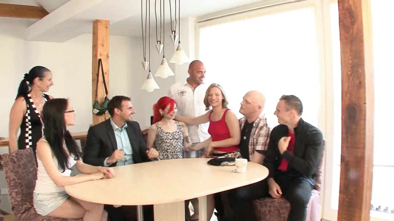 Redhead tattooed German babe rides dick in the kitchen