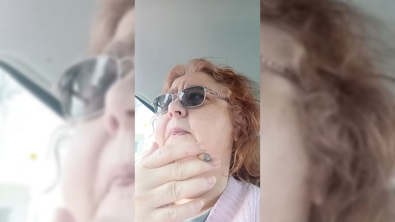 BBW smoking in pink sweater in her car talking to her fans