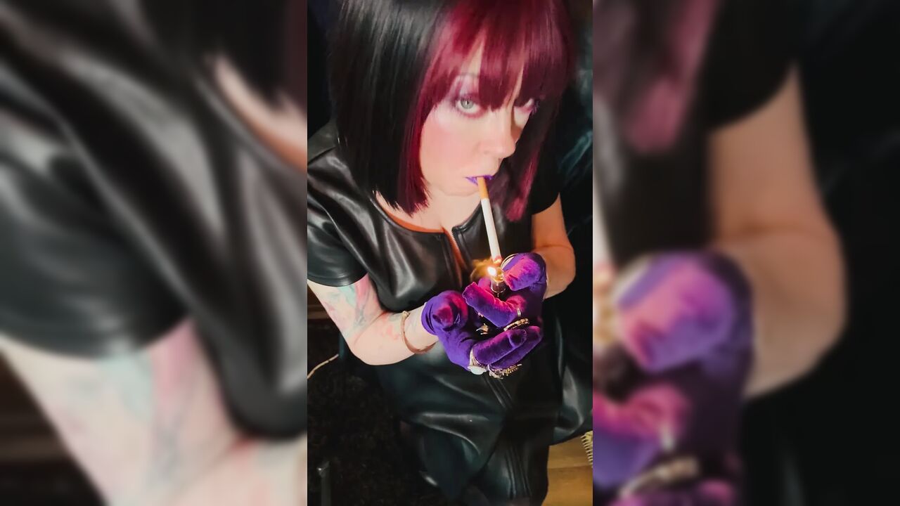 Queen Of Smoking Tina Snua Smoking A Cork Cigarette In Leather & Gloves