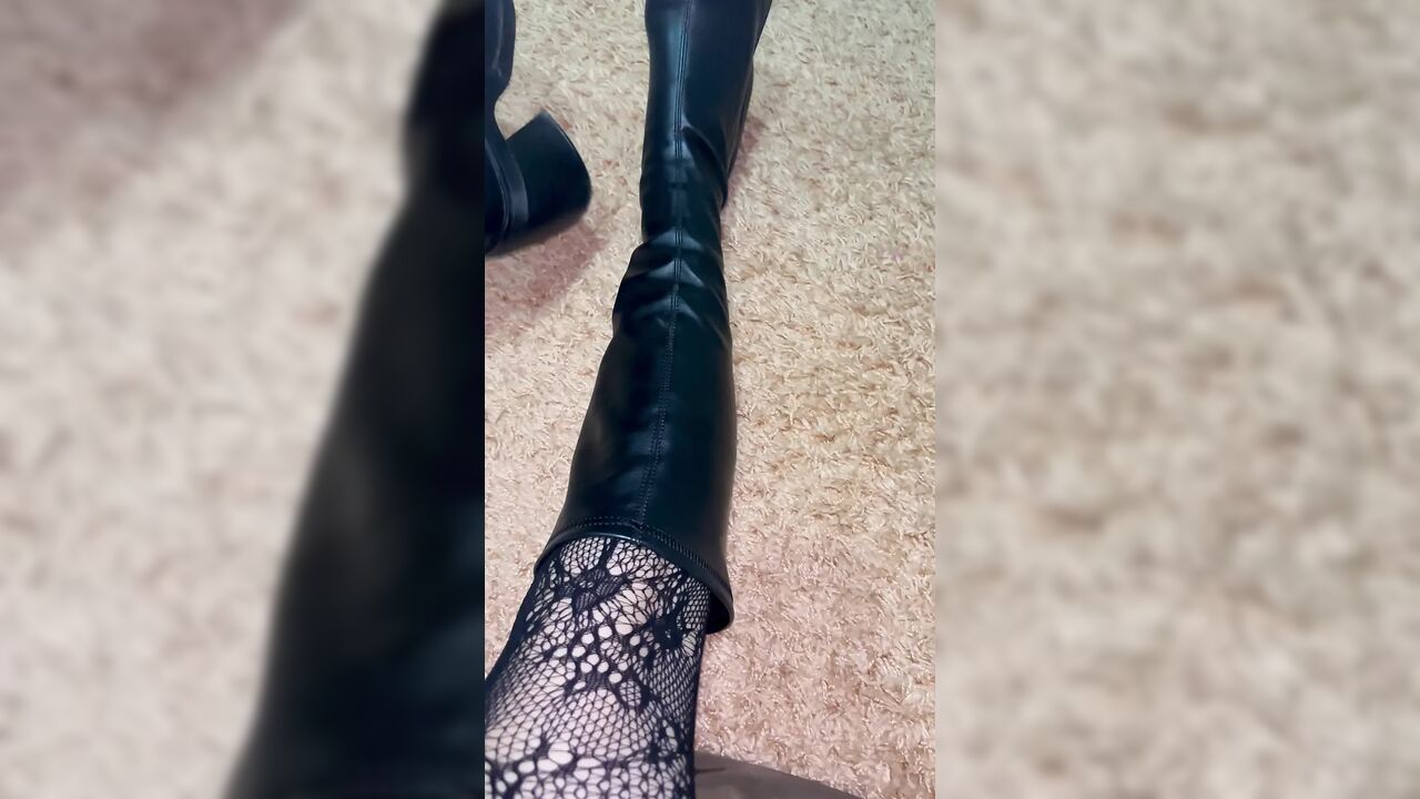 Long legs in black stockings snd boots