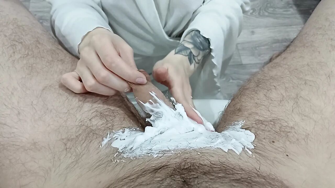 A sexy mature woman shaves her stepson's pubic area and caresses his penis with her oiled tits, the guy cums hard on her breasts