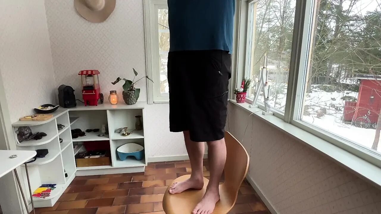 Wife interrupts husband as he does some electricity work in the kitchen