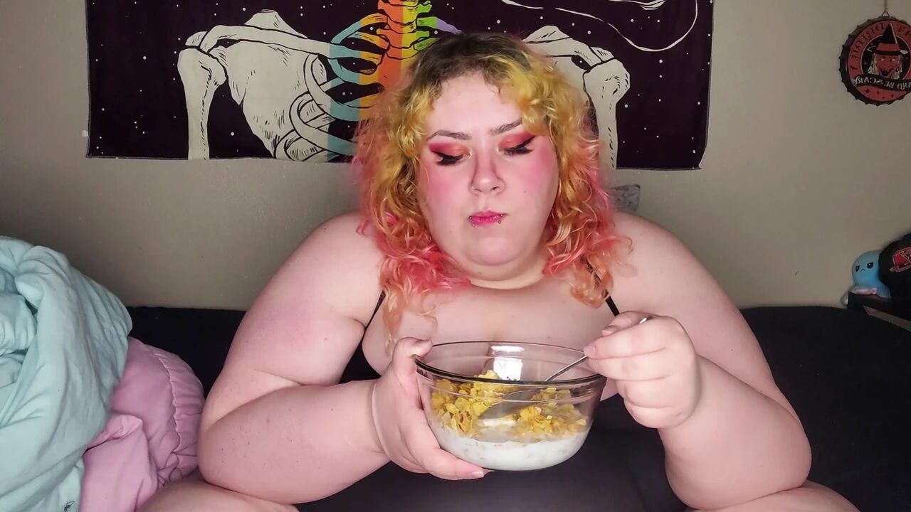 Fat woman eating frosted flakes