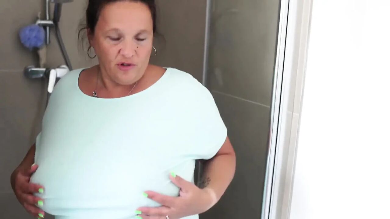 Mature Brunette with Massive Tits Gets Steamy in the Shower