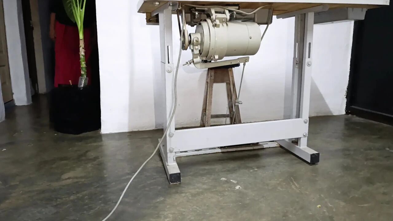 Pumping Sewing Machine Pedal Into Underwear While A Man Repairs It
