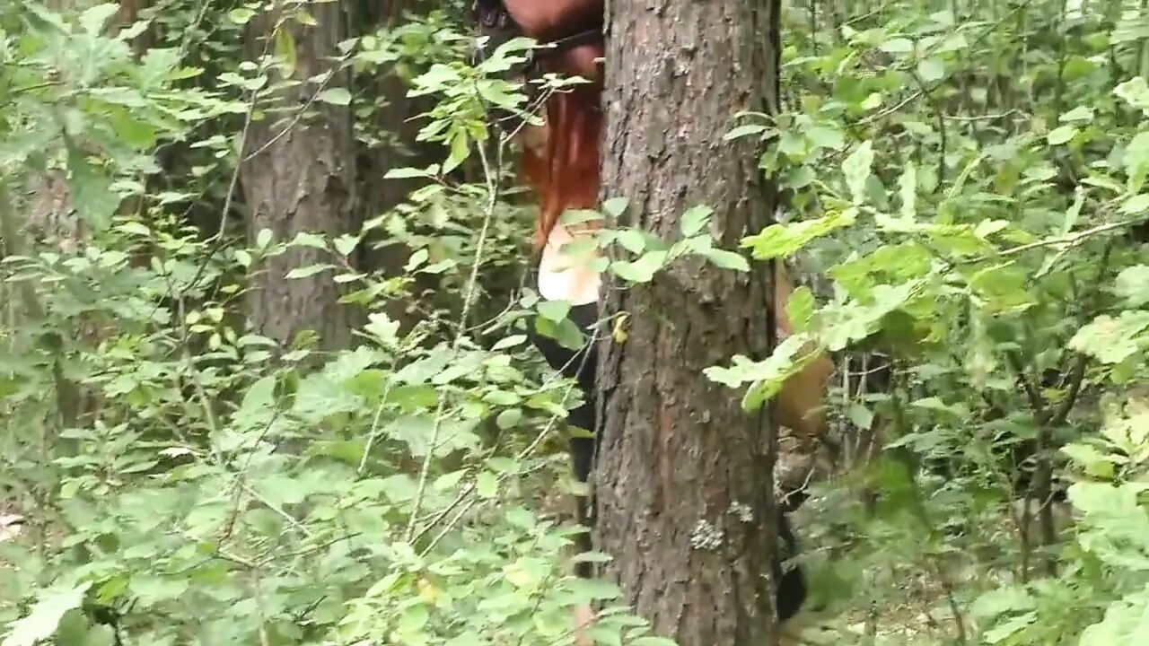 Blowjob in the Woods From the Redheads in a Leather Mask