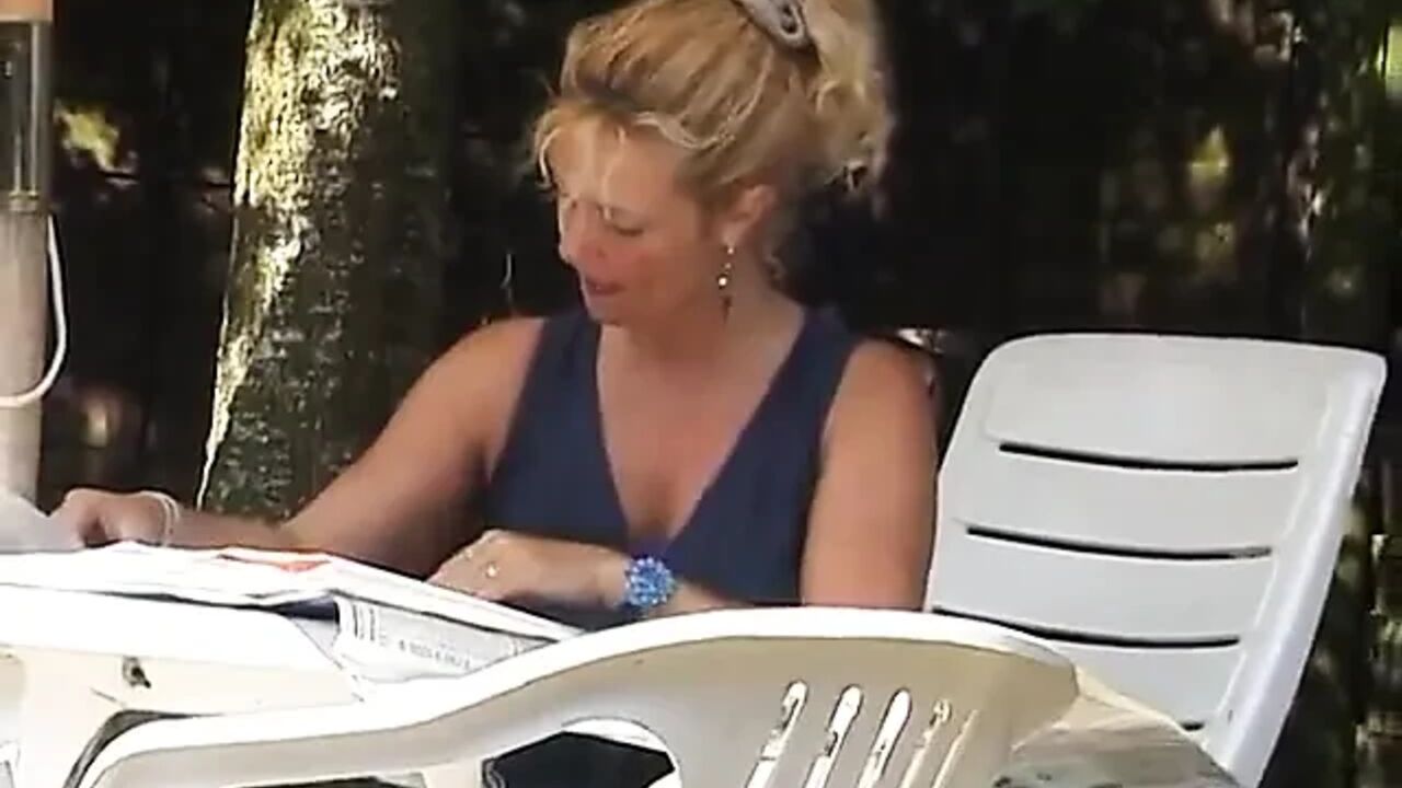 Blonde mature rubs her twat outdoors