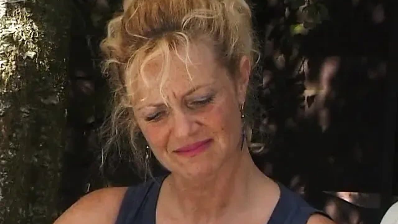 Blonde milf showing off her boobs outdoors
