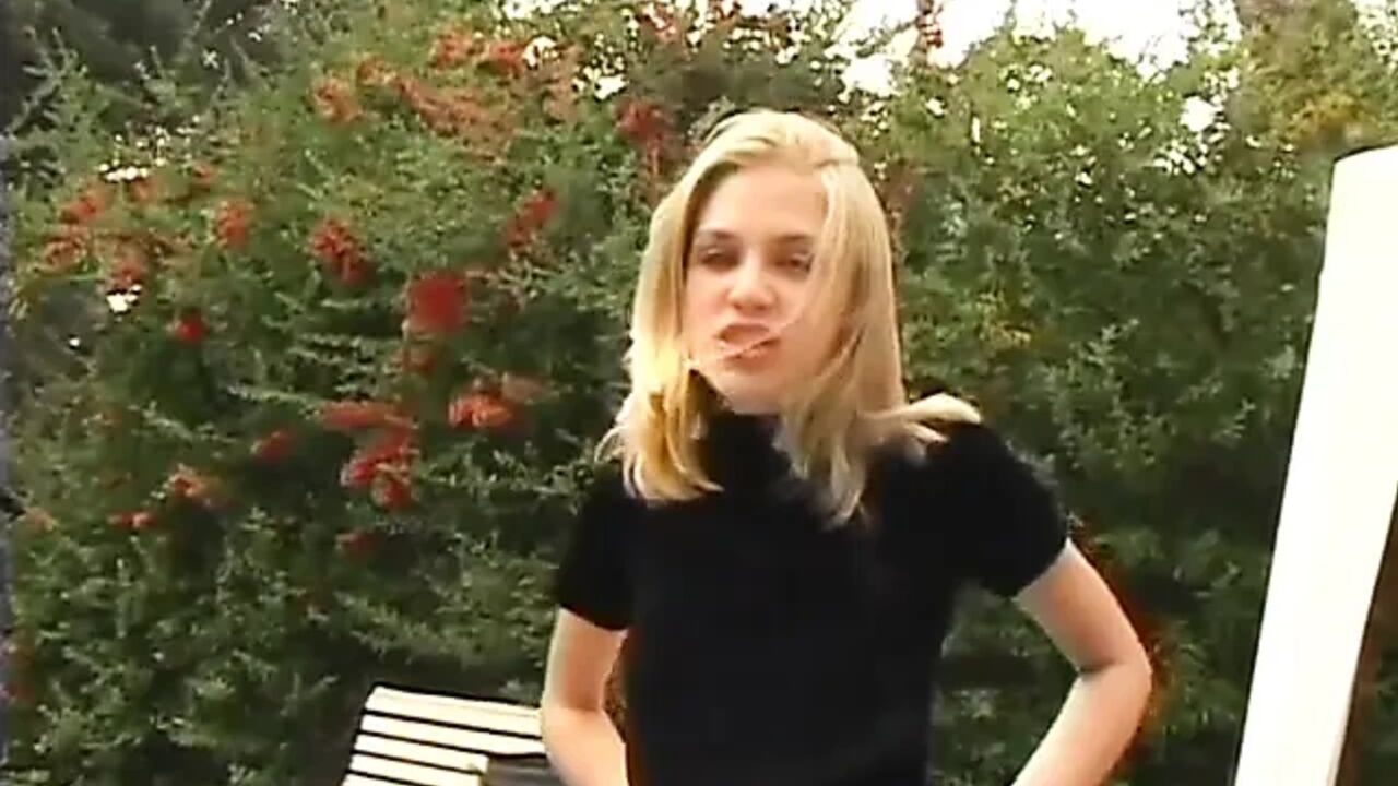 Blond babe sucks cock in the yard