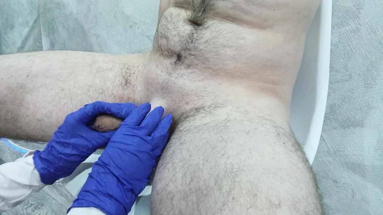 The nurse thoroughly massaged the patient's testicles and penis to collect sperm for analysis.