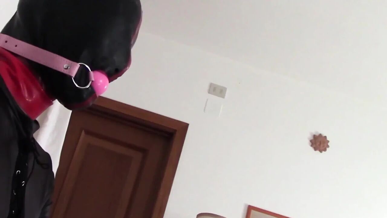 Laura hooded in a very close view of a great blowjob action with ring gag and huge cum swallow