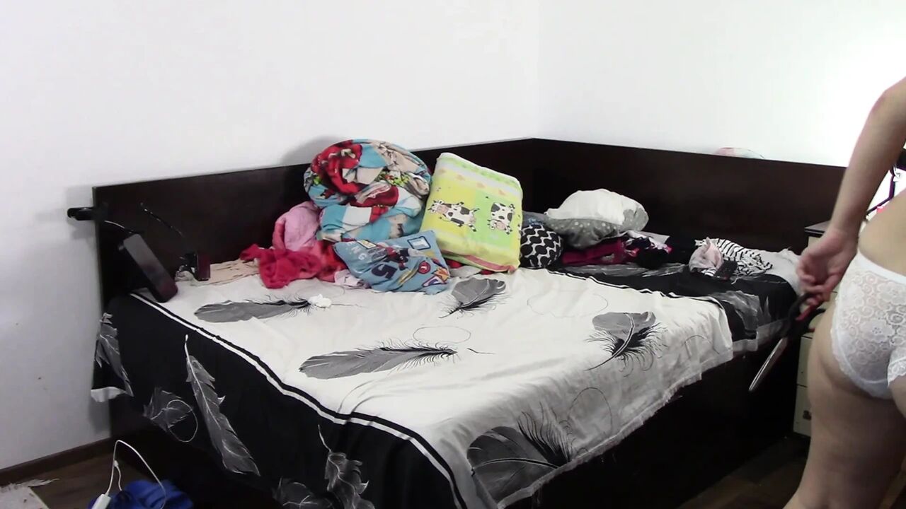Amateur wife has fun trying on clothes and cutting them