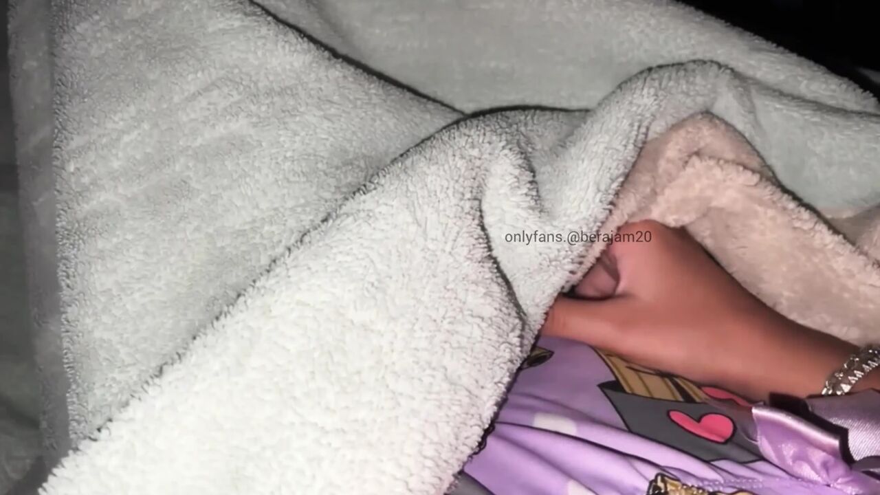Hot young girl. Under the sheets, she wets her panties with orgasm.