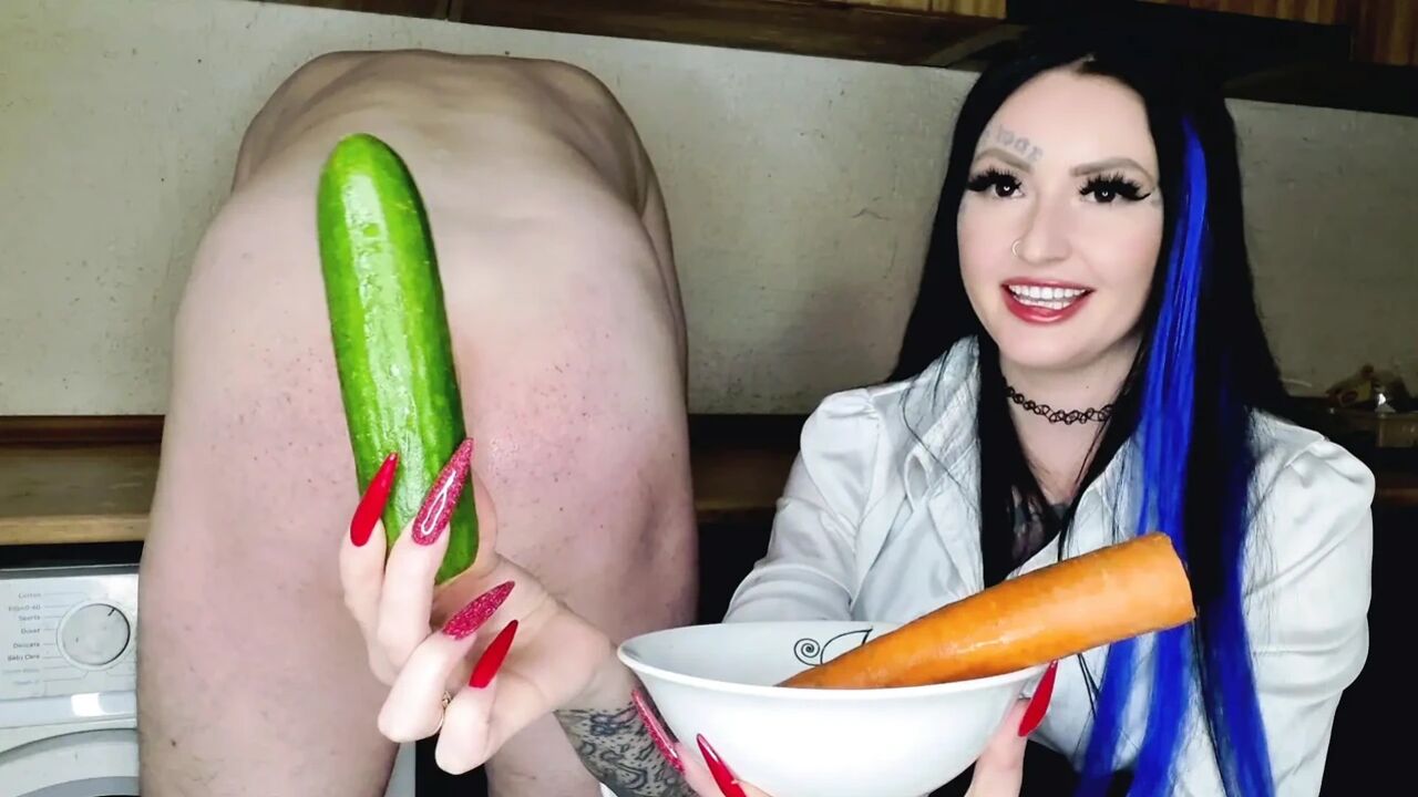 Cook with Dominatrix Nika. The mistress prepared carrots and cucumbers for the slave's anus. Ass masturbation with vegetables.